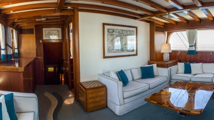a living room with a couch and a table aboard FEI-SEEN Yacht for Sale