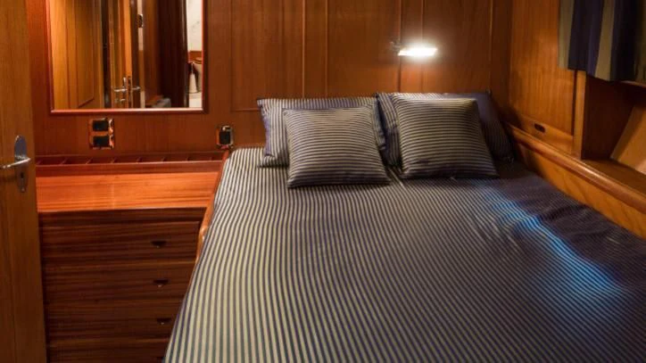 a bed with pillows aboard FEI-SEEN Yacht for Sale