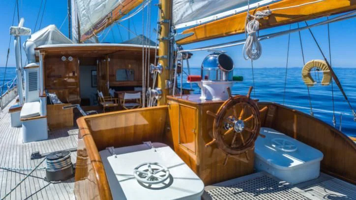 a boat with a large wheel aboard FEI-SEEN Yacht for Sale