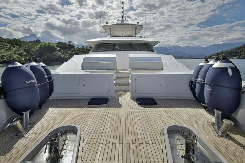 a large white boat on a dock aboard PAPA-GOLFE Yacht for Sale