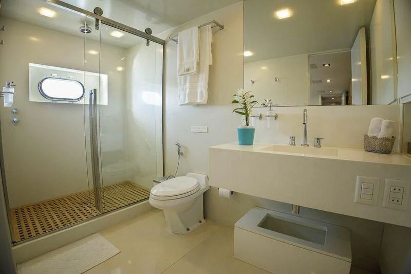 a bathroom with a glass shower aboard PAPA-GOLFE Yacht for Sale