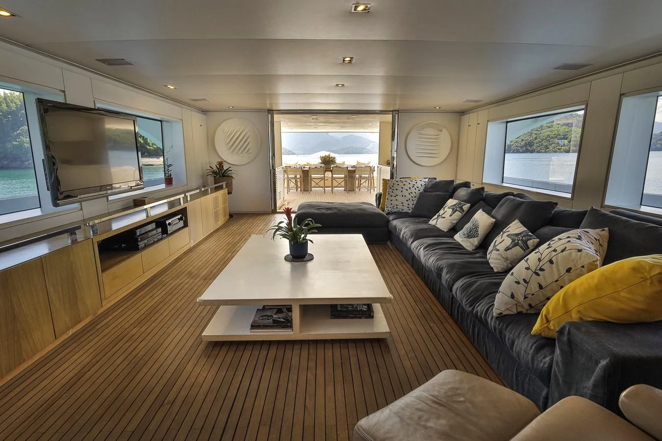 a living room with a large tv aboard PAPA-GOLFE Yacht for Sale