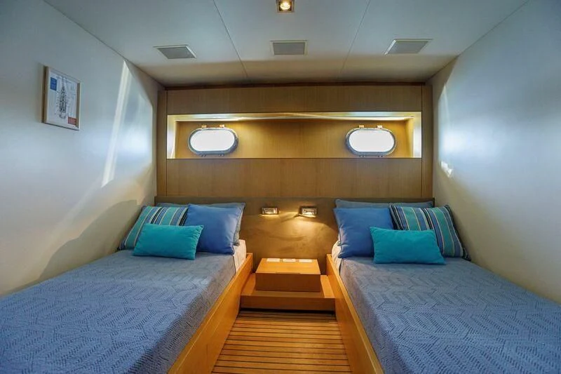 a room with two beds aboard PAPA-GOLFE Yacht for Sale