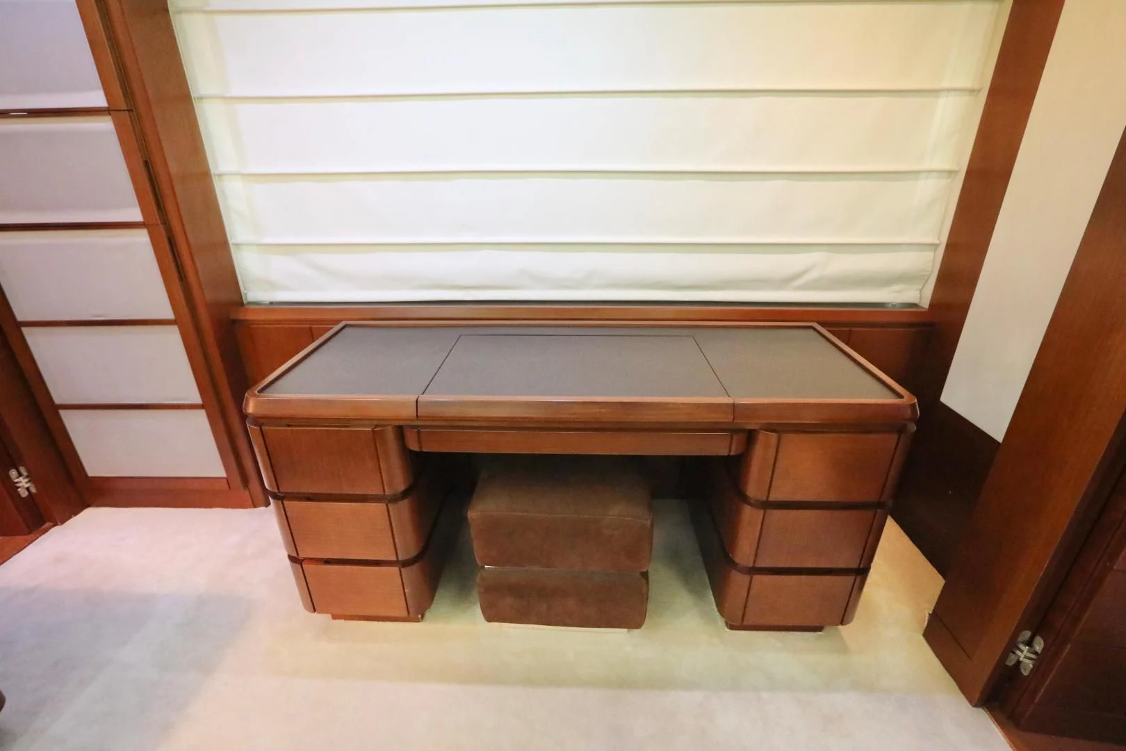 a wooden shelf with a white wall aboard ANDREIKA Yacht for Sale