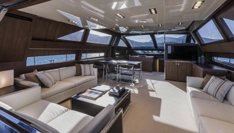 a room with a couch and a table and a tv aboard OXIDANTE Yacht for Sale
