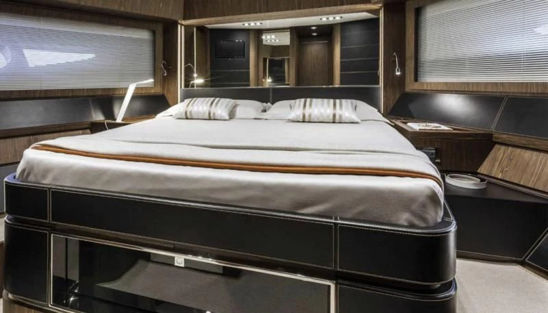 a bed in a room aboard OXIDANTE Yacht for Sale