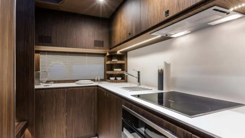 a kitchen with a sink and cabinets aboard OXIDANTE Yacht for Sale