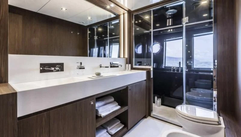 a bathroom with a large mirror aboard OXIDANTE Yacht for Sale