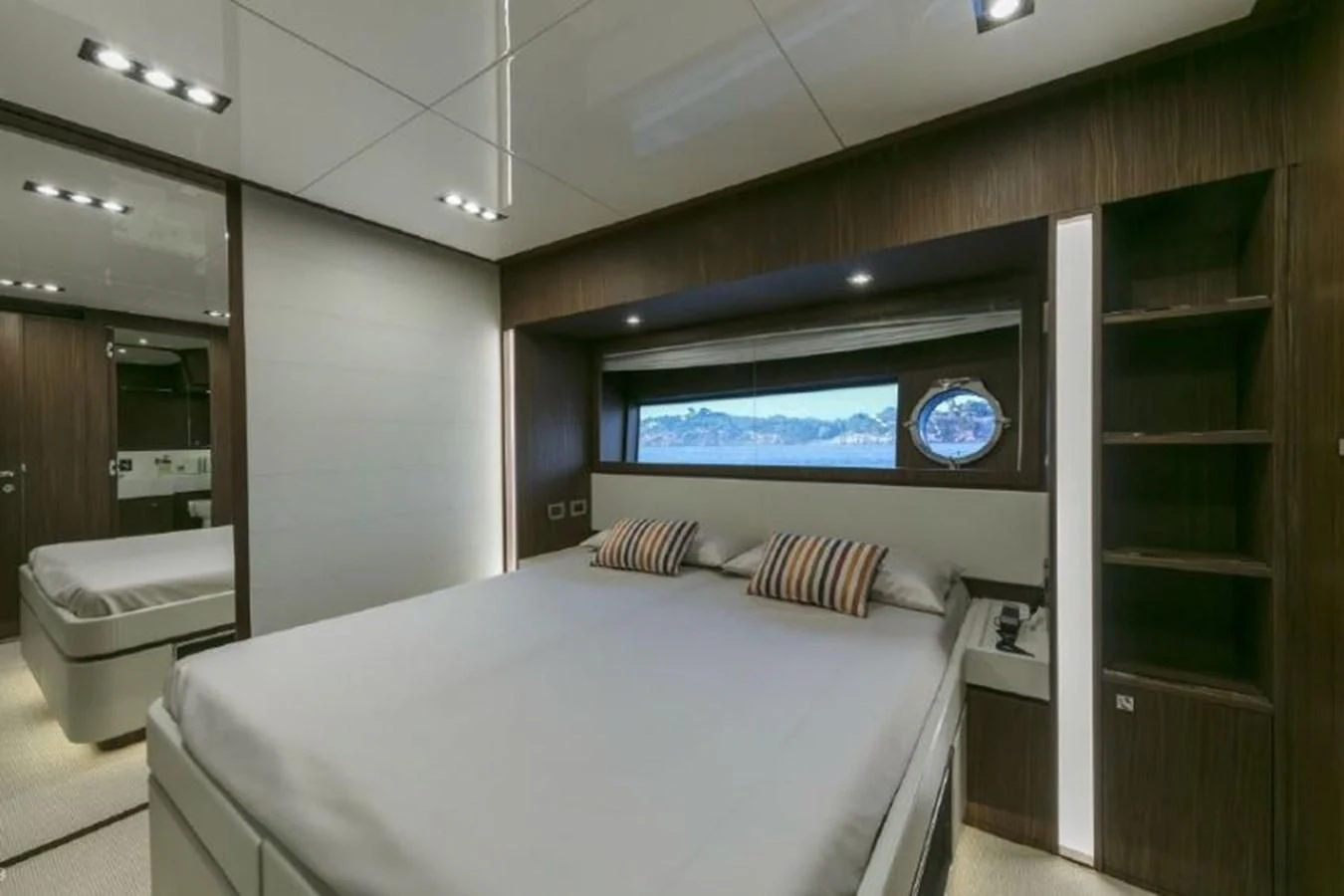 a room with a bed and a tv on the wall aboard OXIDANTE Yacht for Sale