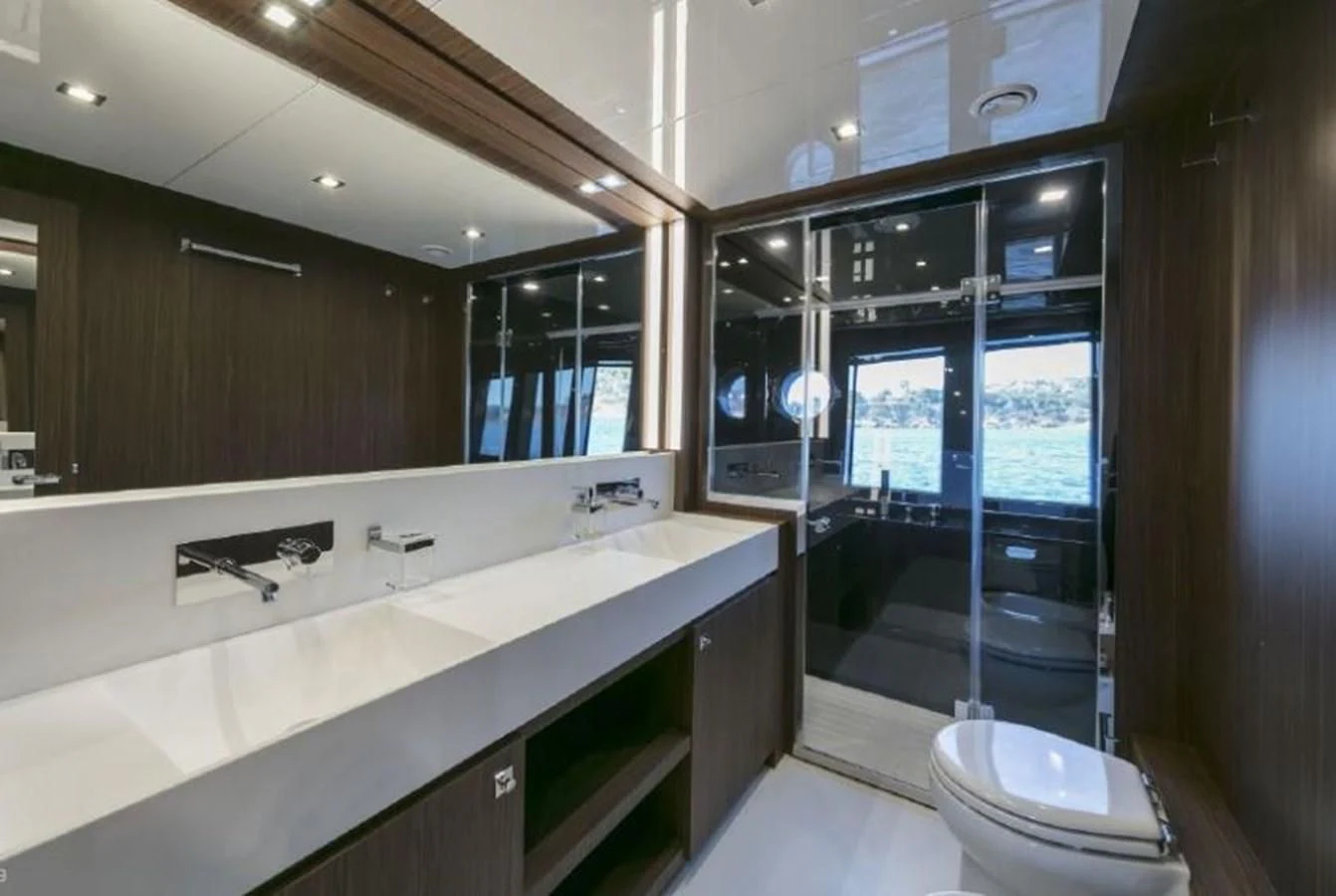 a bathroom with a large mirror aboard OXIDANTE Yacht for Sale