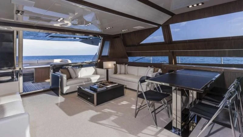 a room with a pool table and couches aboard OXIDANTE Yacht for Sale