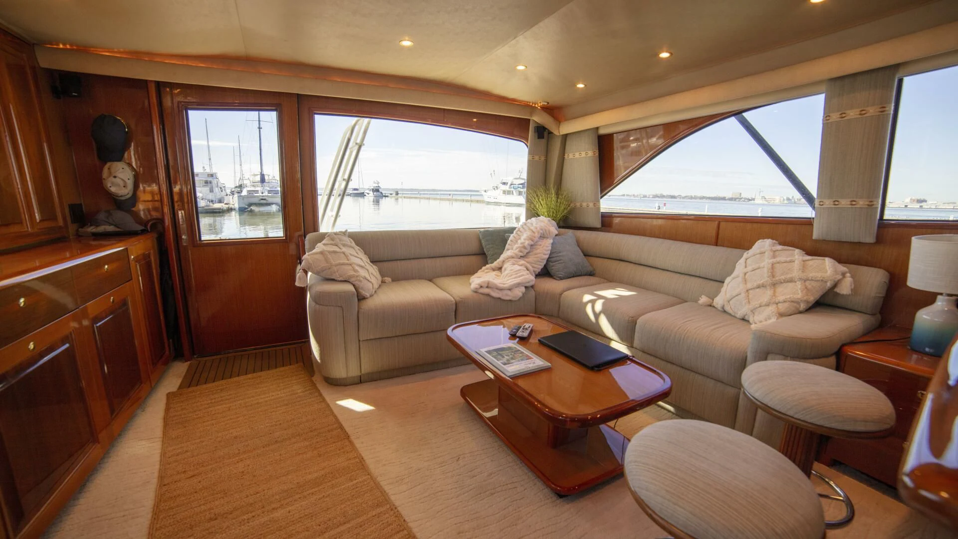 a living room with a couch and coffee table aboard PRIME TIME Yacht for Sale