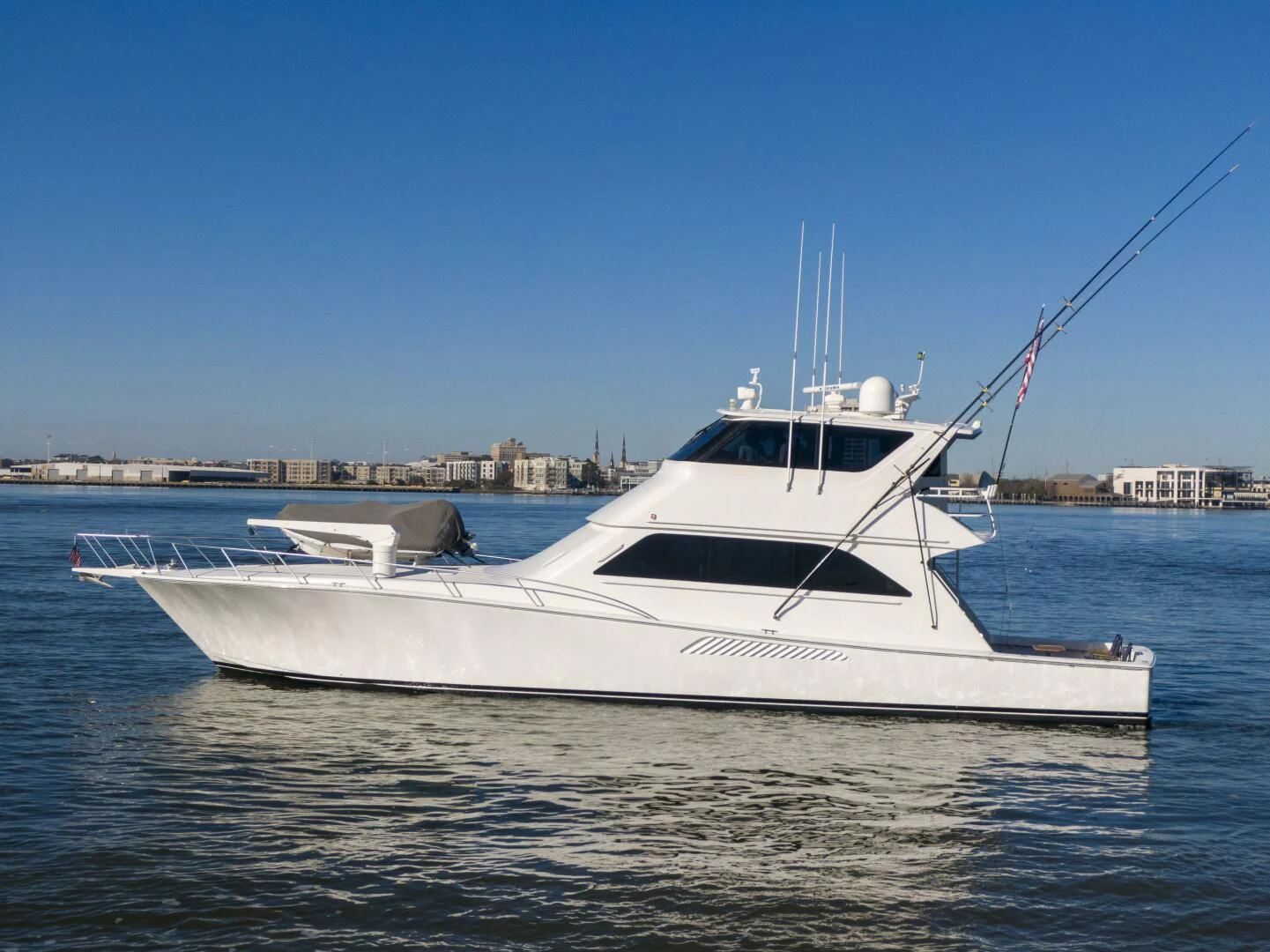 a white boat on the water aboard PRIME TIME Yacht for Sale