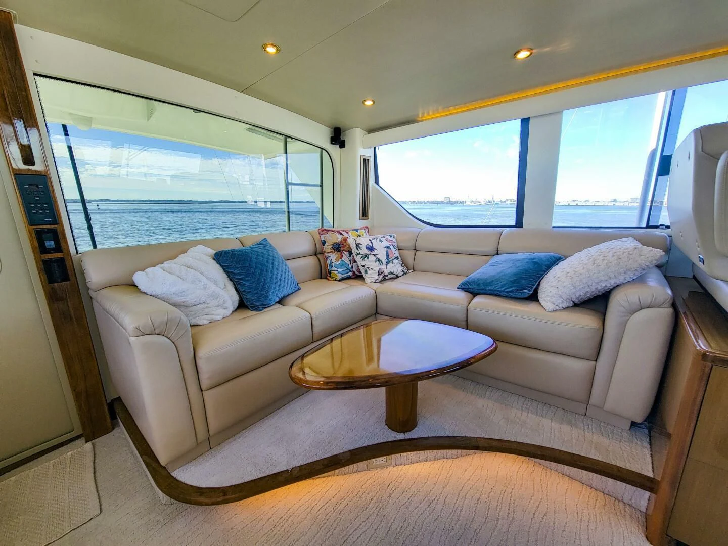 a living room with a large window aboard PRIME TIME Yacht for Sale
