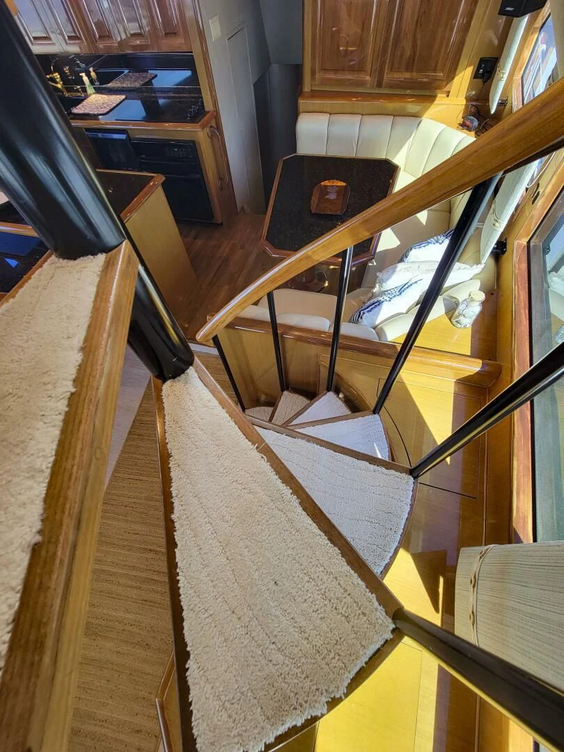 a room with a table and chairs aboard PRIME TIME Yacht for Sale