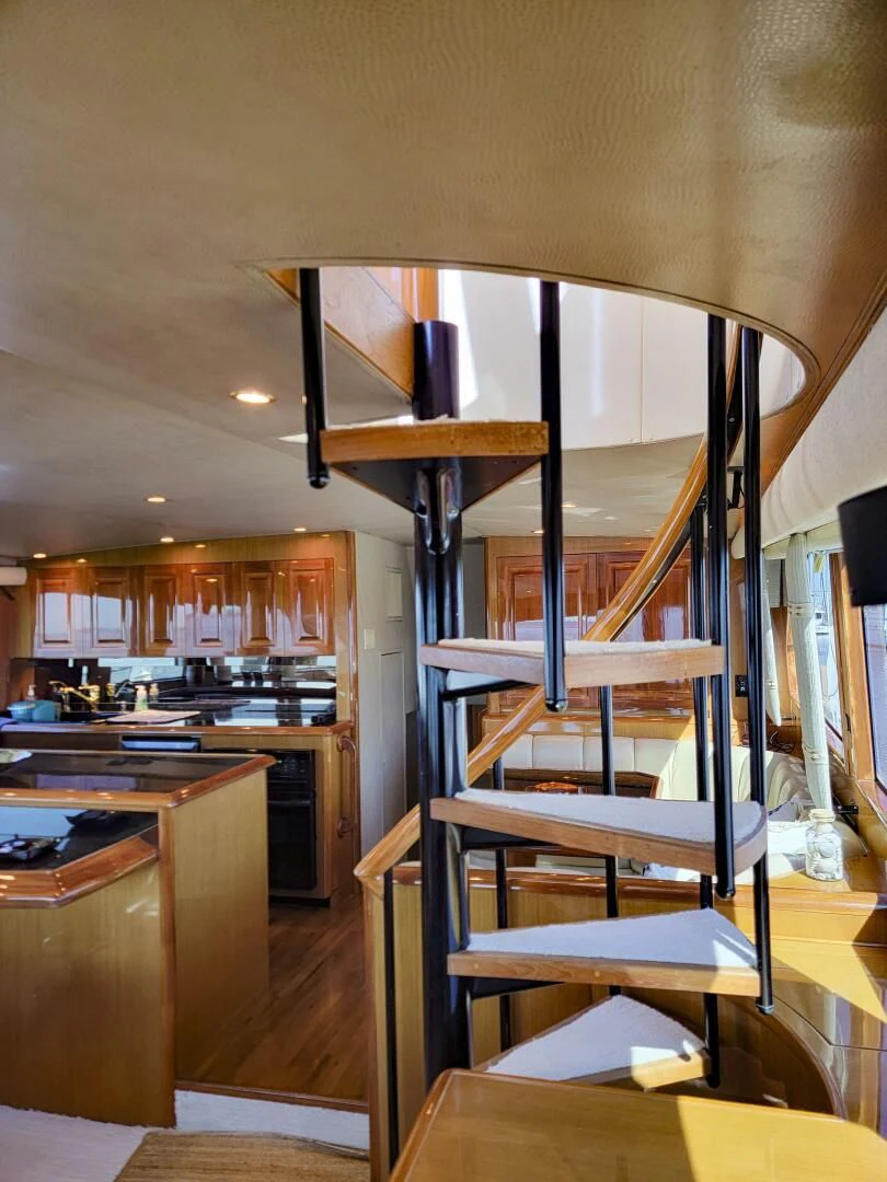 a ladder in a kitchen aboard PRIME TIME Yacht for Sale