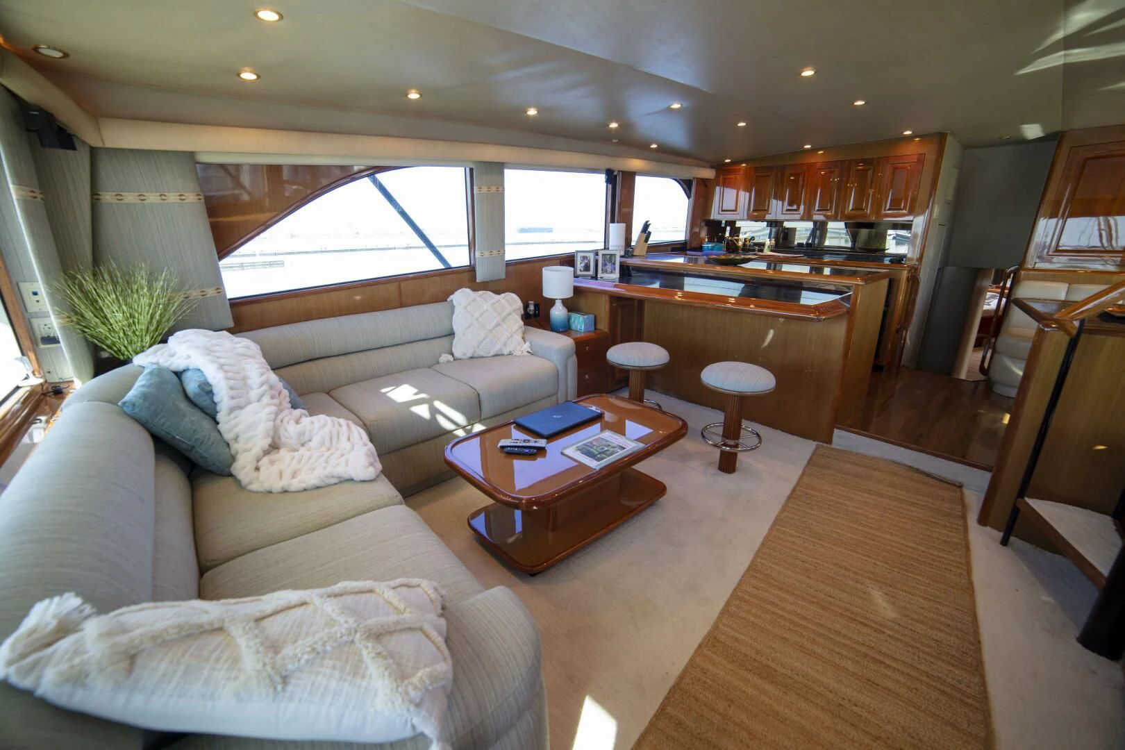 a living room with a couch and a coffee table aboard PRIME TIME Yacht for Sale