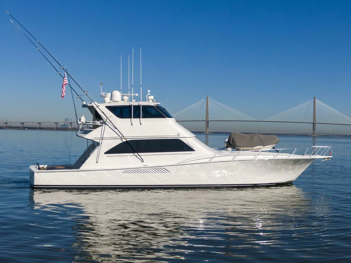 a white boat on the water aboard PRIME TIME Yacht for Sale