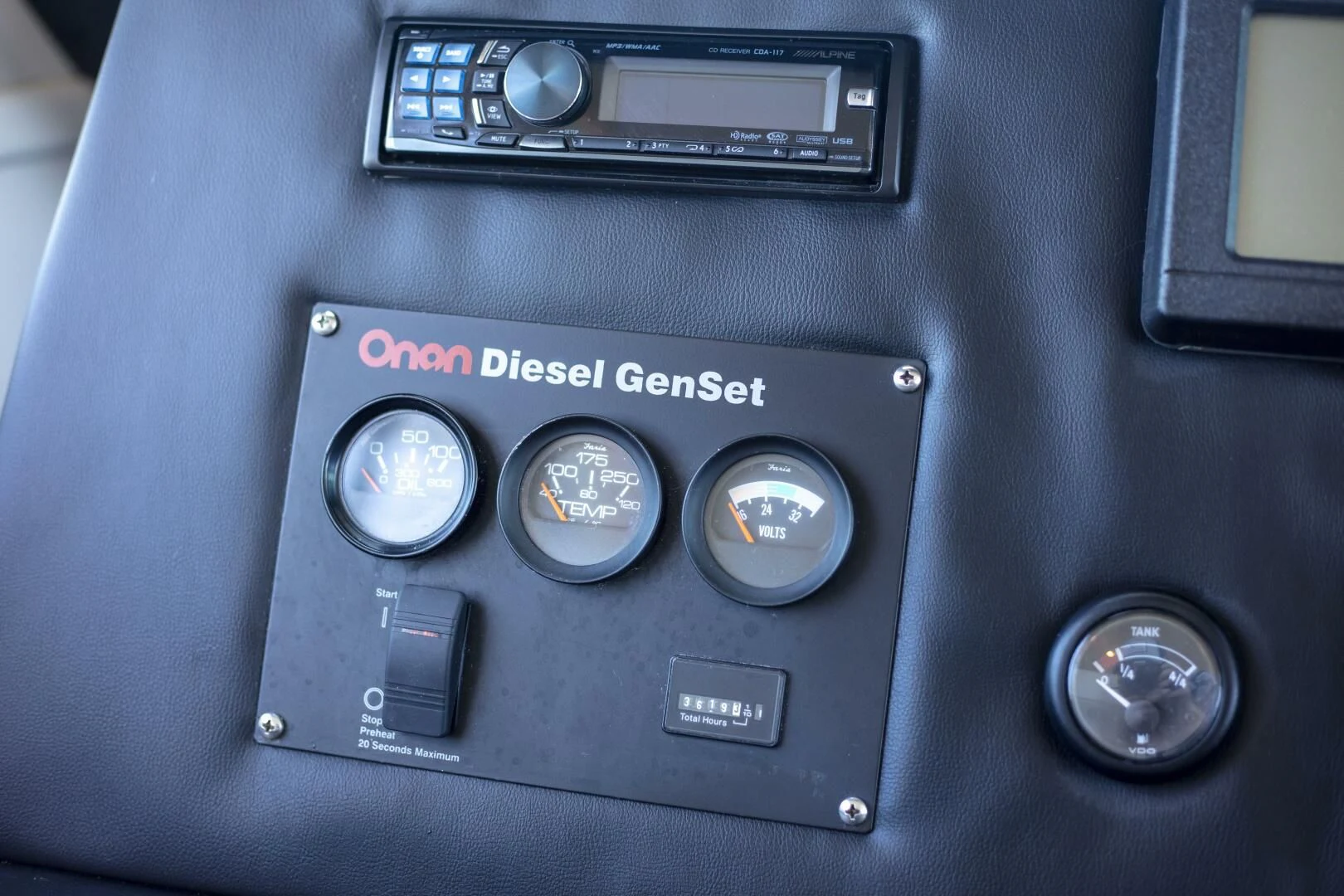 a car dashboard with a screen and buttons aboard PRIME TIME Yacht for Sale