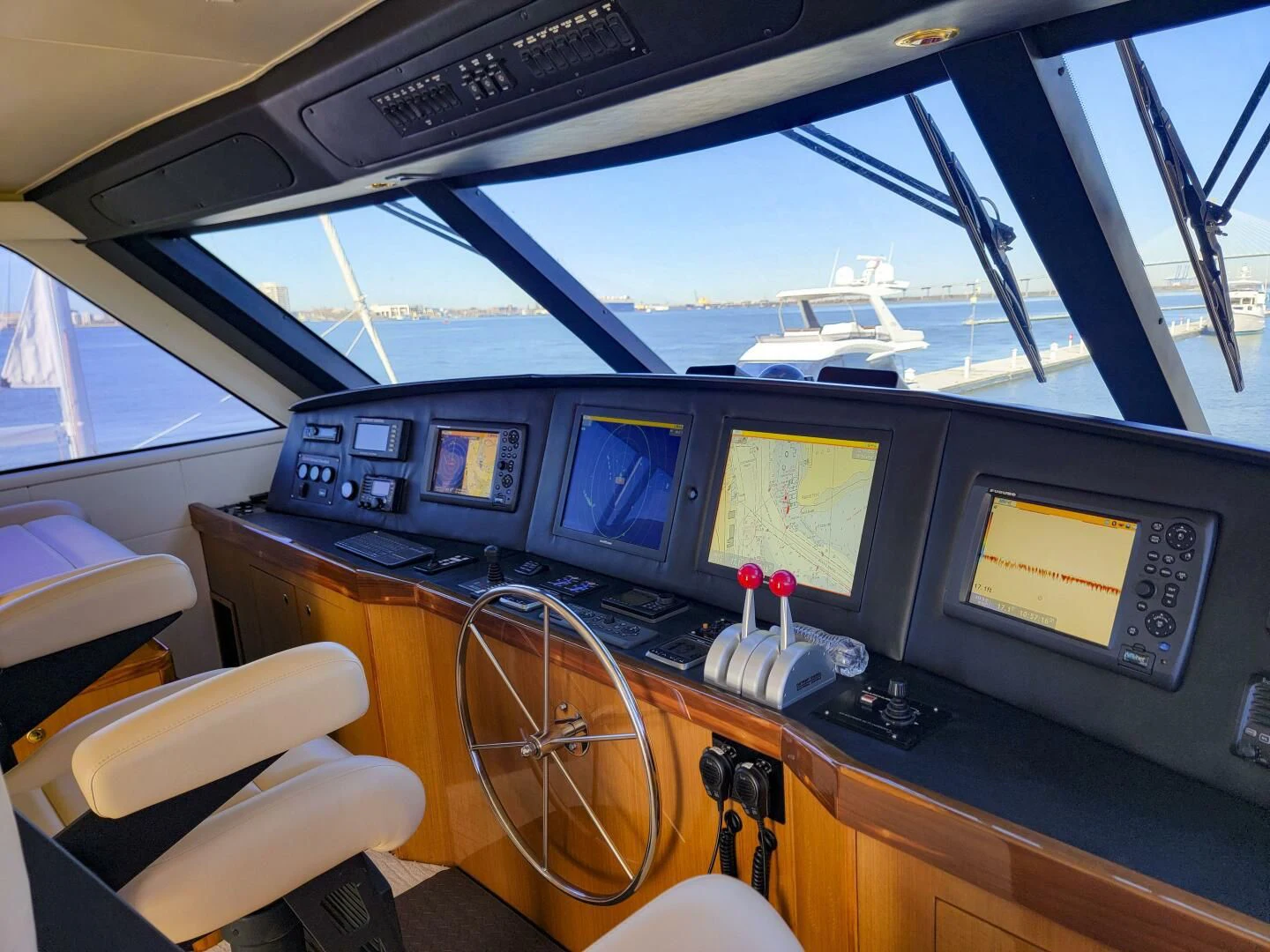 a plane cockpit with many screens aboard PRIME TIME Yacht for Sale