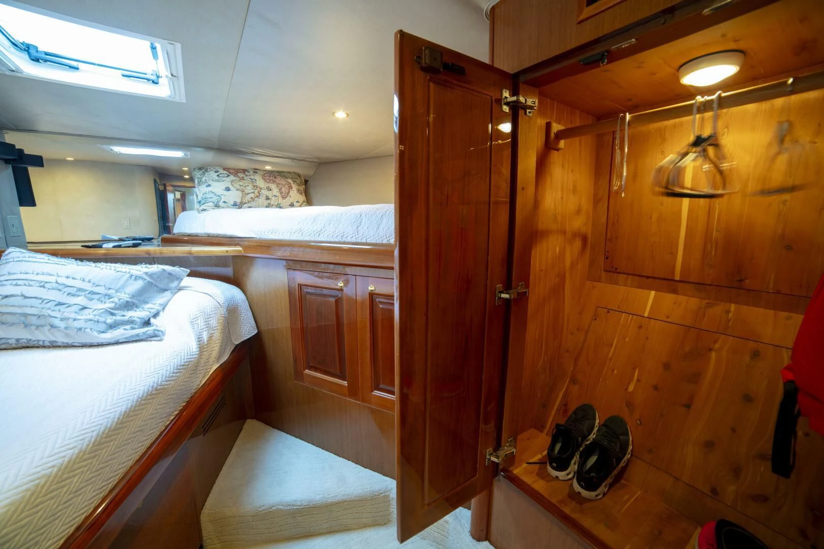 a room with wooden walls and a bed aboard PRIME TIME Yacht for Sale