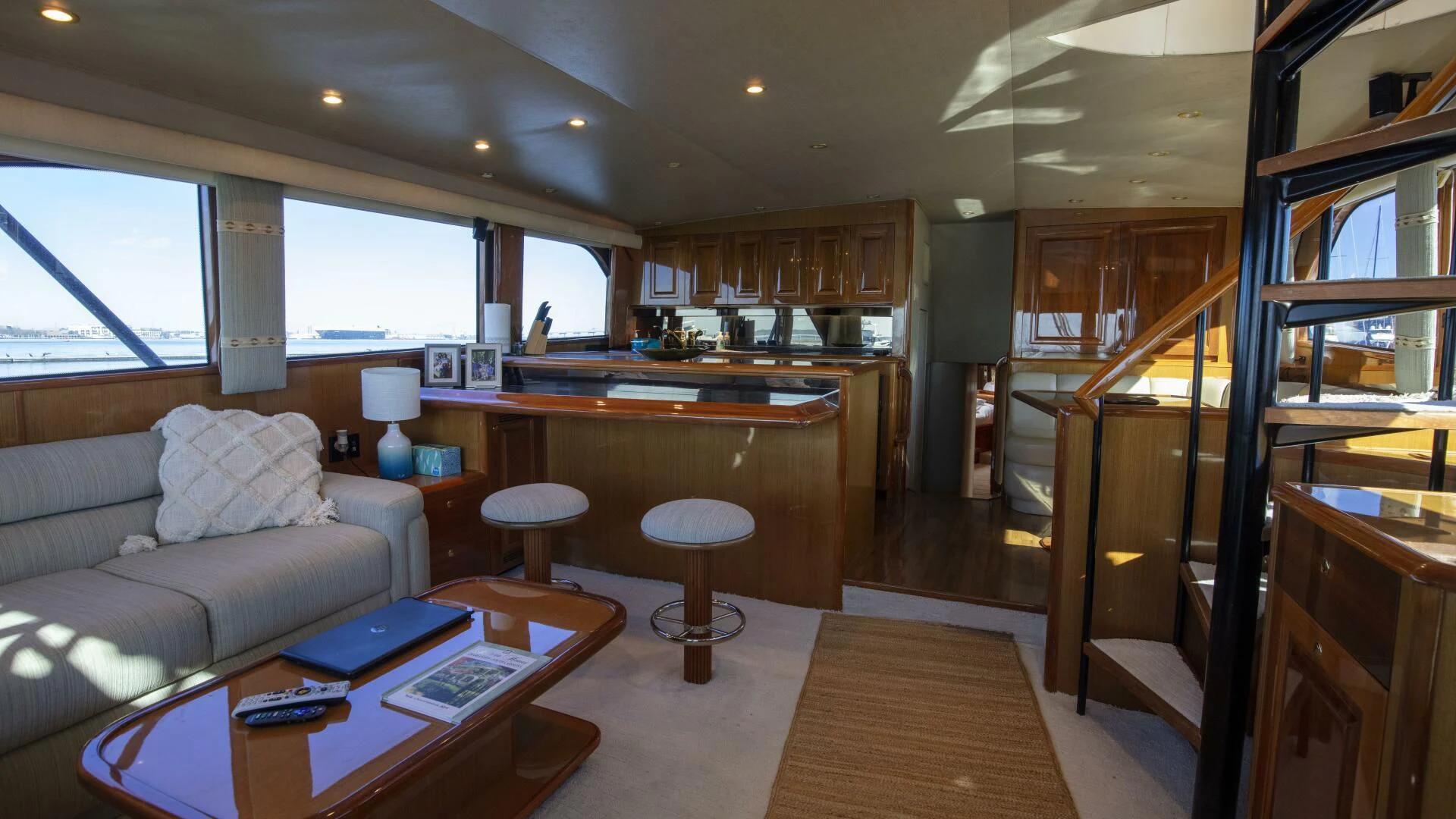 a living room with a couch and a table aboard PRIME TIME Yacht for Sale