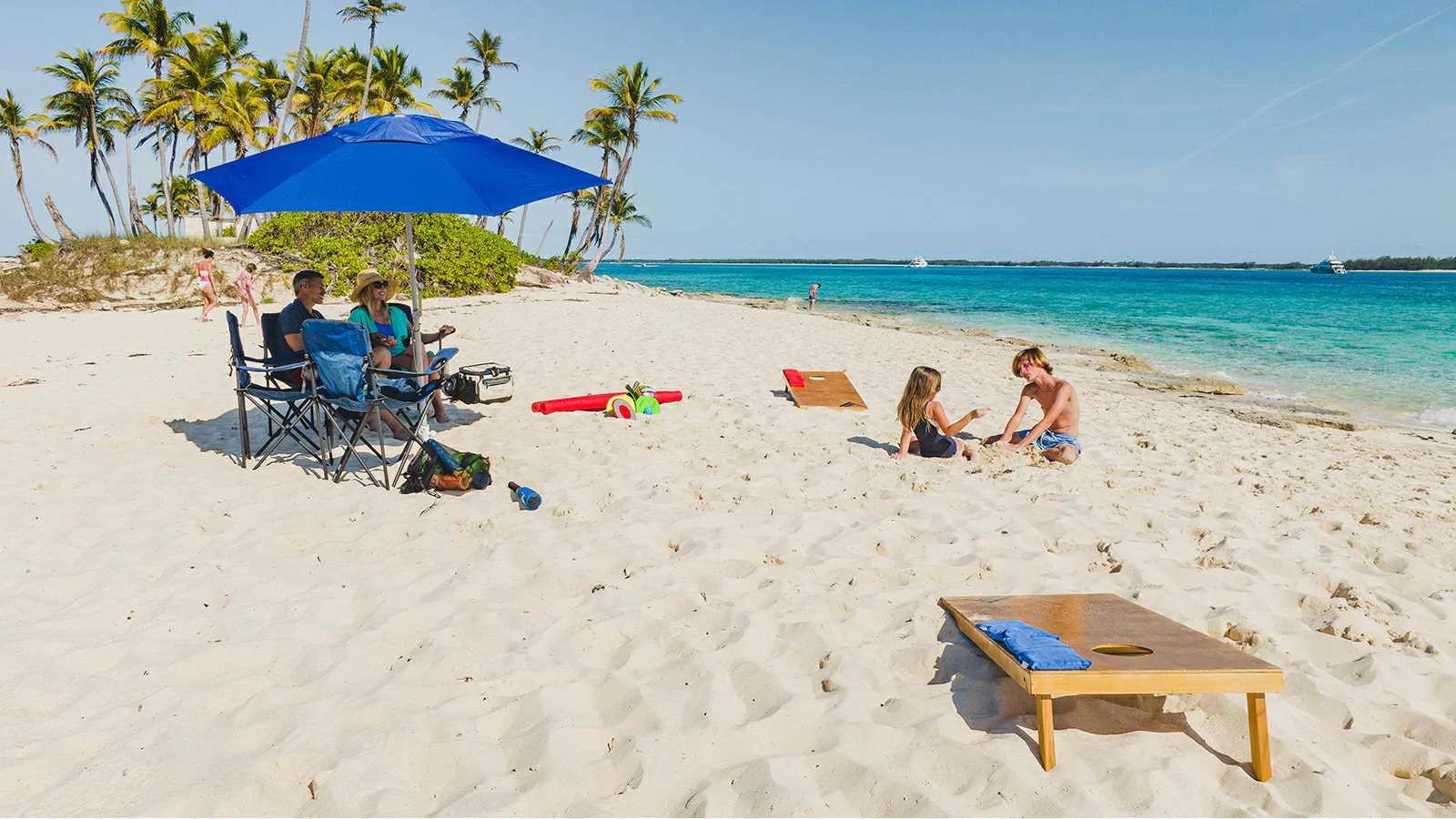 people sitting on beach aboard ALTA Yacht for Sale