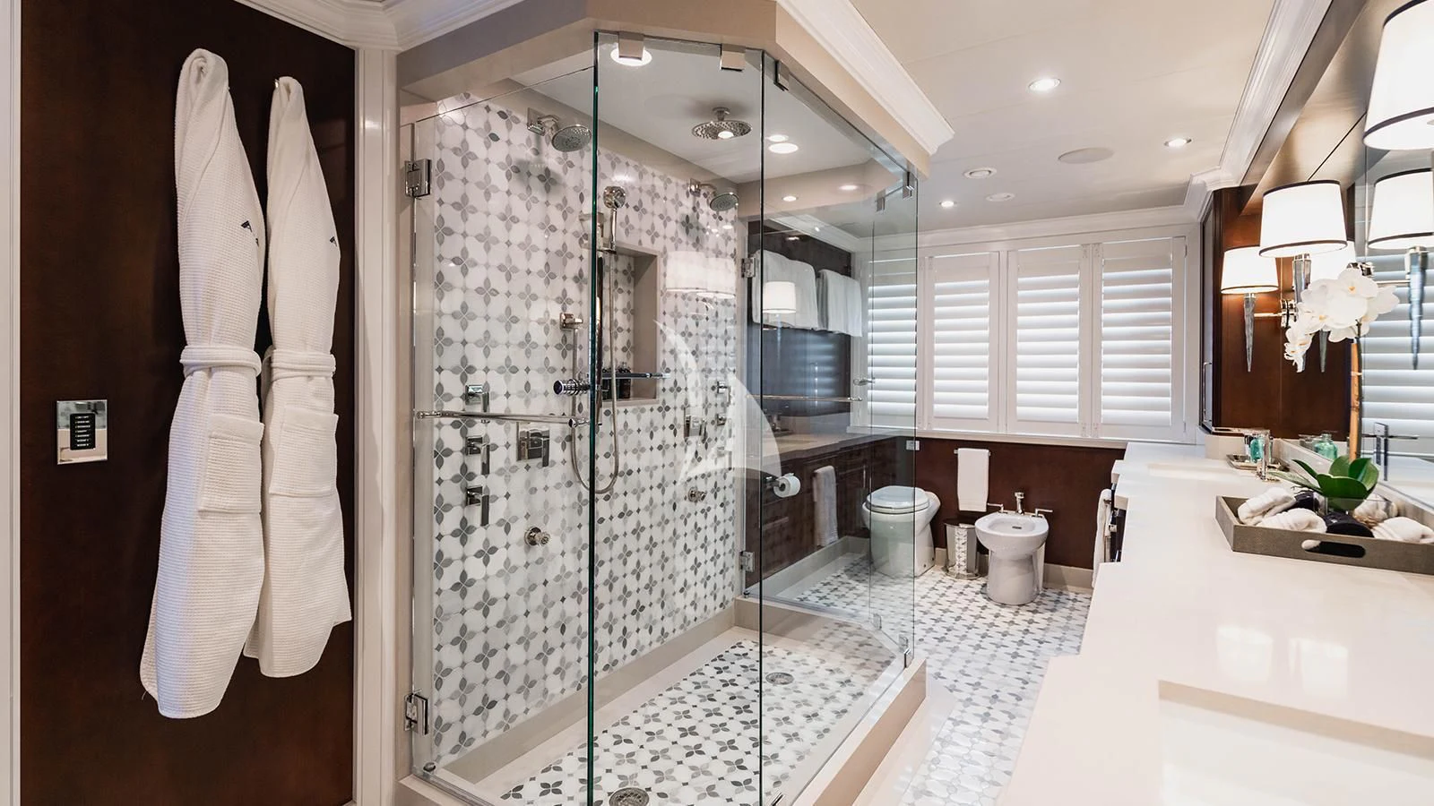 a bathroom with a large glass shower aboard ALTA Yacht for Sale