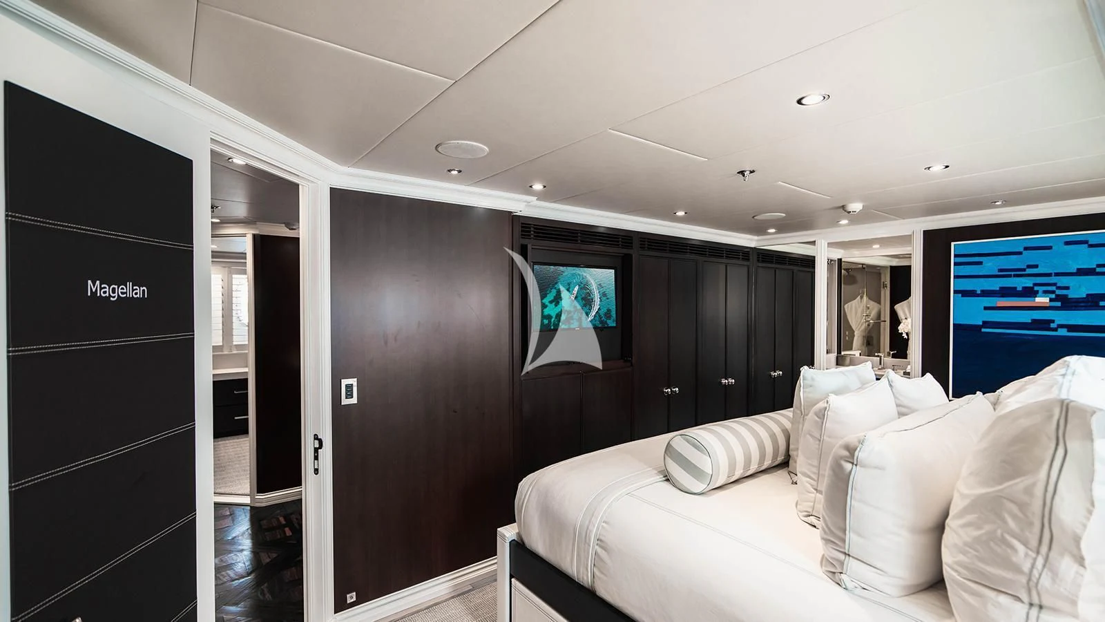 a room with a bed and a television aboard ALTA Yacht for Sale