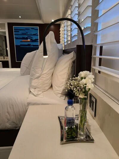 a vase of flowers on a table aboard ALTA Yacht for Sale