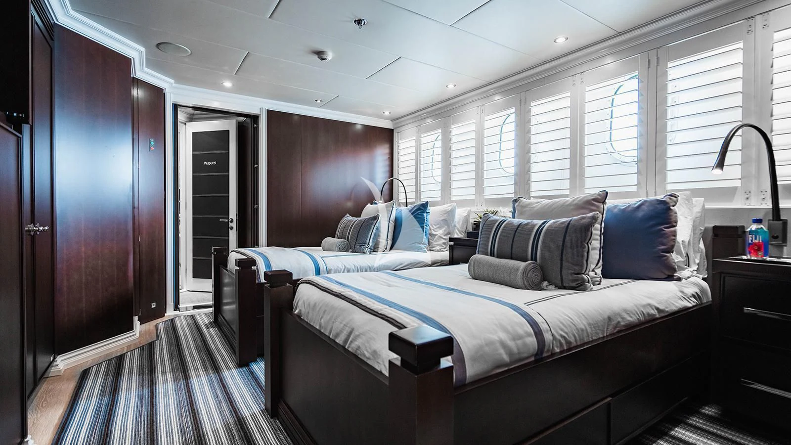 a bedroom with a bed and a window aboard ALTA Yacht for Sale