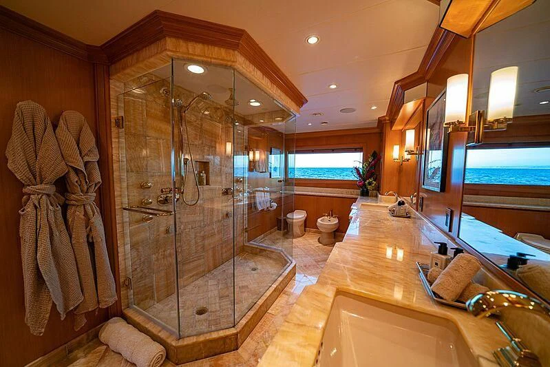 a bathroom with a shower unit and a sink aboard ALTA Yacht for Sale
