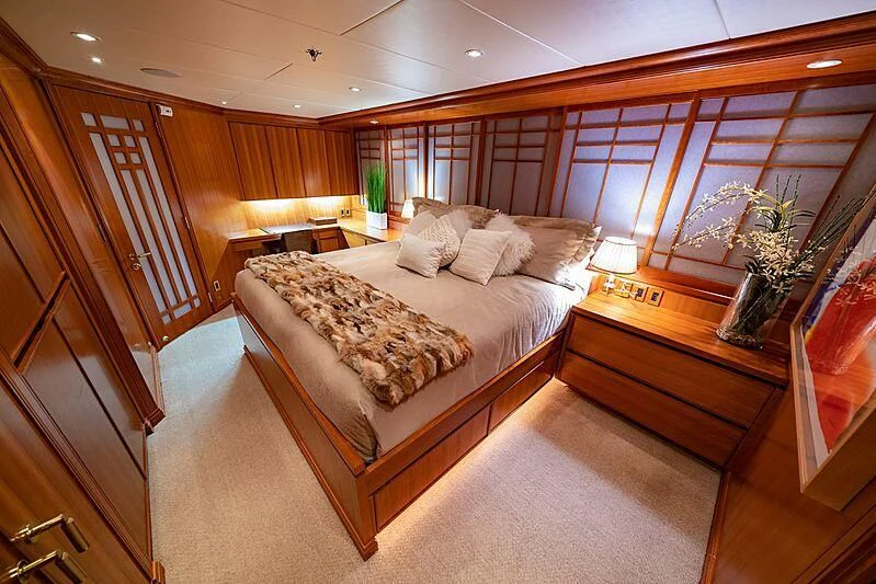 a large bed in a room aboard ALTA Yacht for Sale