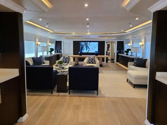 a room with a table and chairs aboard ALTA Yacht for Sale