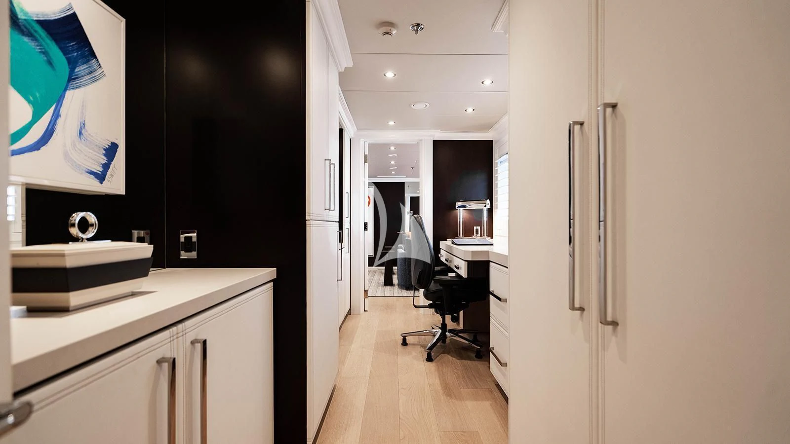 a kitchen with a large black cabinet aboard ALTA Yacht for Sale