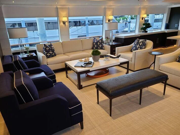 a living room with a table and chairs aboard ALTA Yacht for Sale