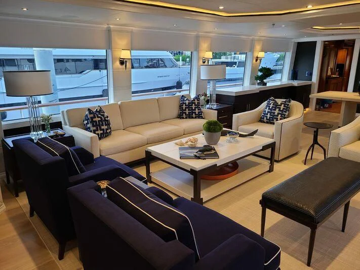a living room with a large window aboard ALTA Yacht for Sale