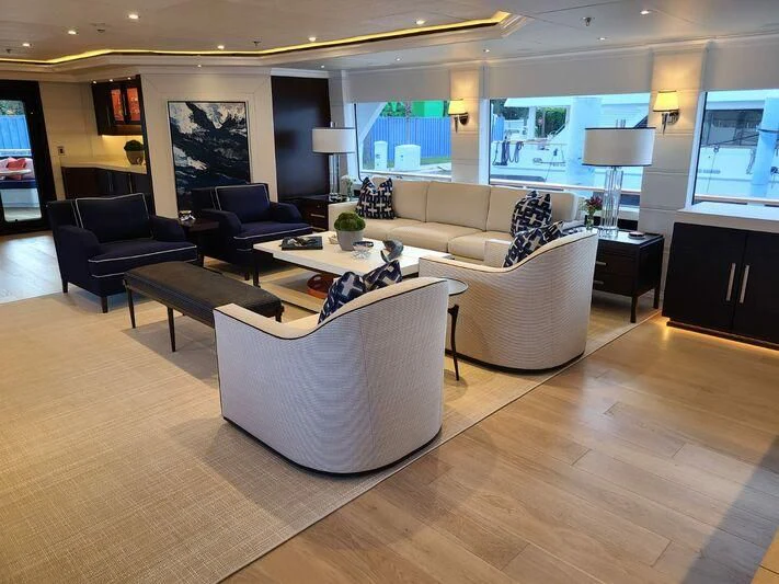 a living room with a large screen aboard ALTA Yacht for Sale