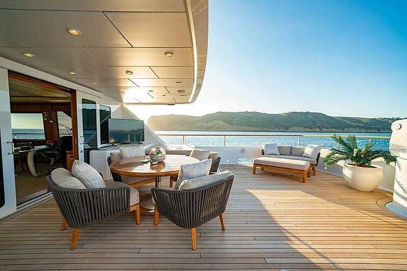 a living room with a table and chairs aboard ALTA Yacht for Sale