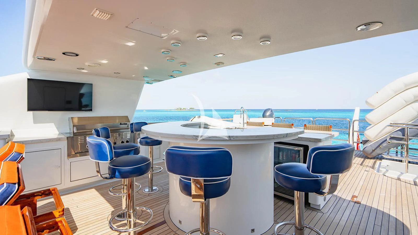 a room with a table chairs and a television aboard ALTA Yacht for Sale
