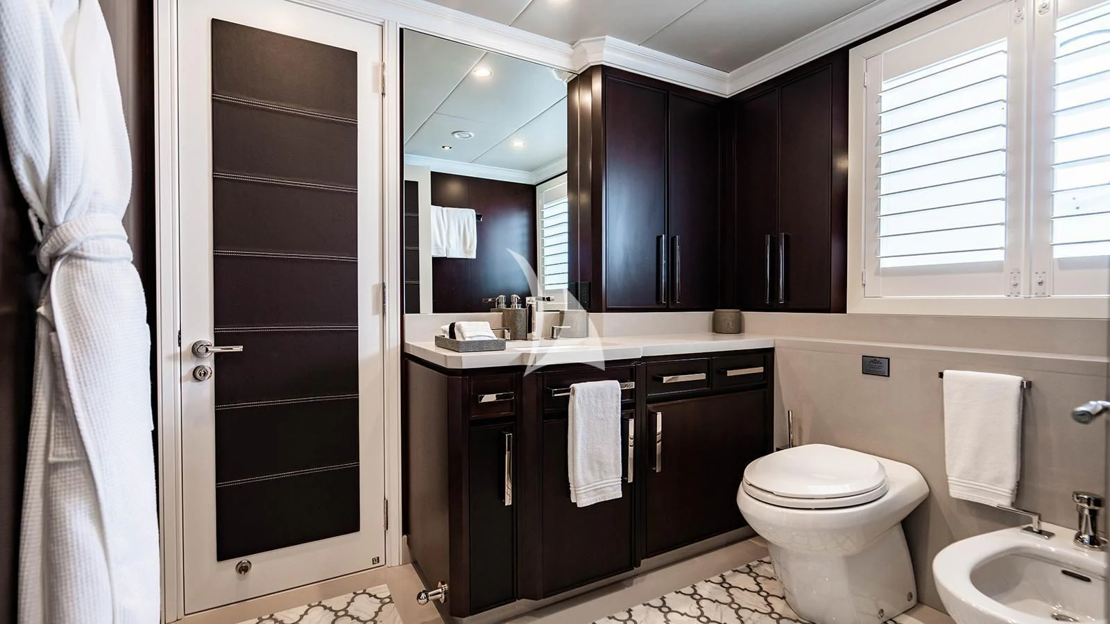 a bathroom with a toilet and sink aboard ALTA Yacht for Sale