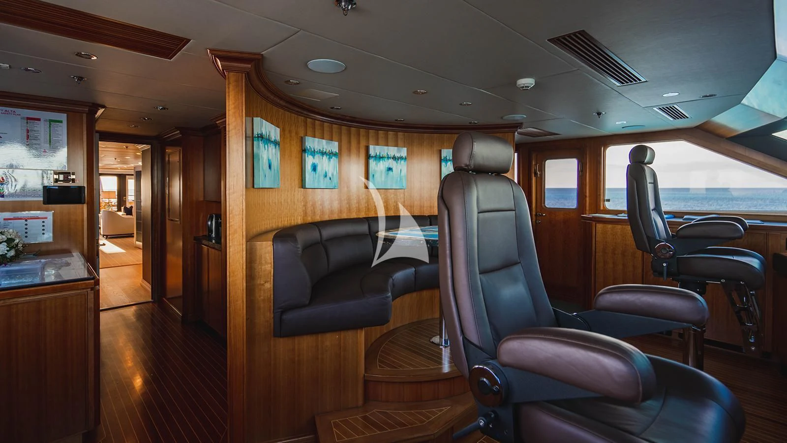 a room with chairs and a table aboard ALTA Yacht for Sale