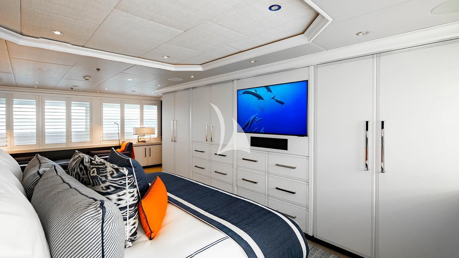 a room with a tv and a bed aboard ALTA Yacht for Sale