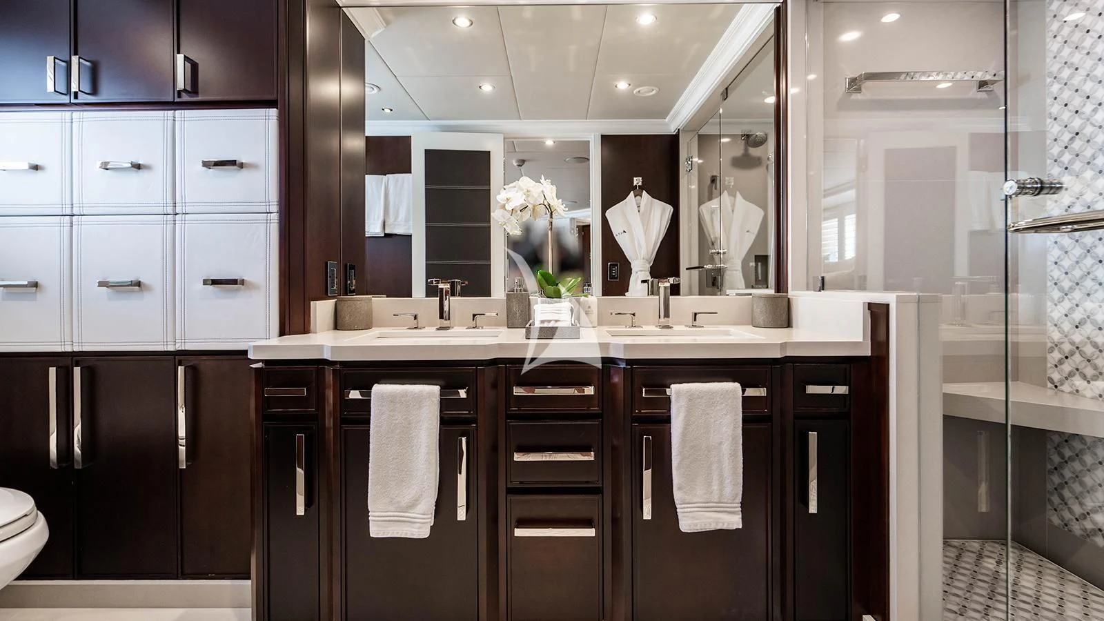 a bathroom with black cabinets aboard ALTA Yacht for Sale