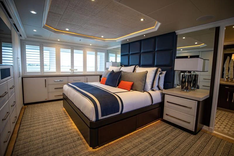 a large bedroom with a large bed aboard ALTA Yacht for Sale
