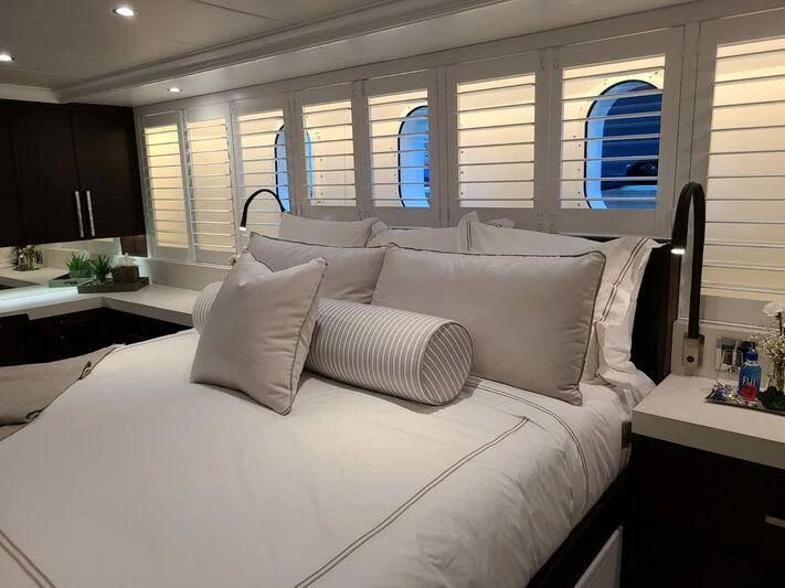 a bed with white sheets aboard ALTA Yacht for Sale