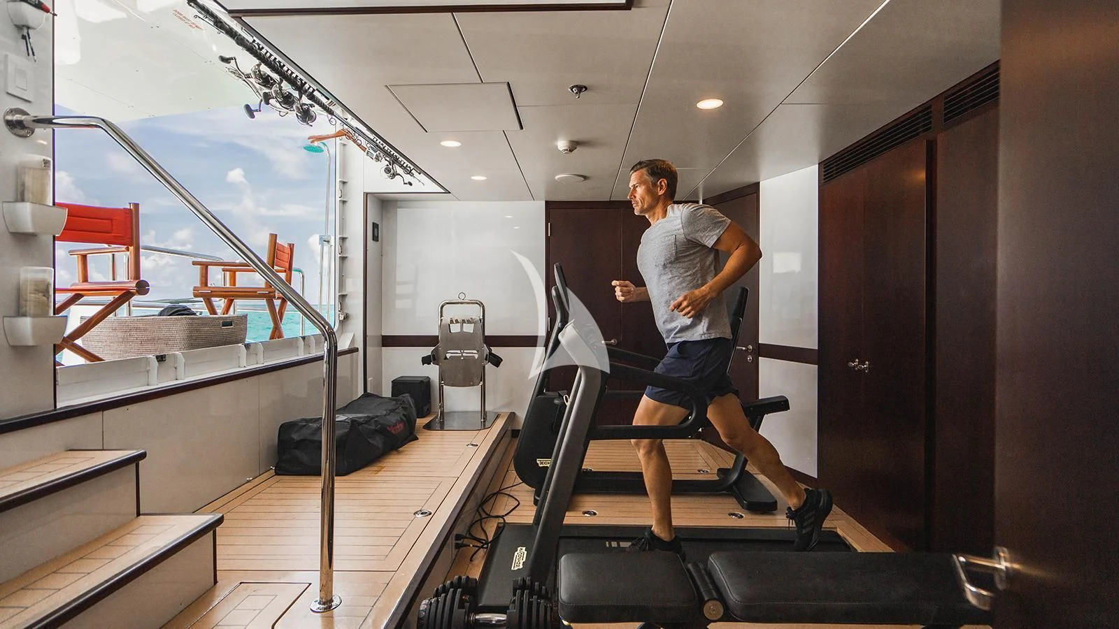 a man running on a treadmill aboard ALTA Yacht for Sale