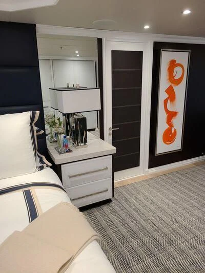 a room with a bed and a desk aboard ALTA Yacht for Sale