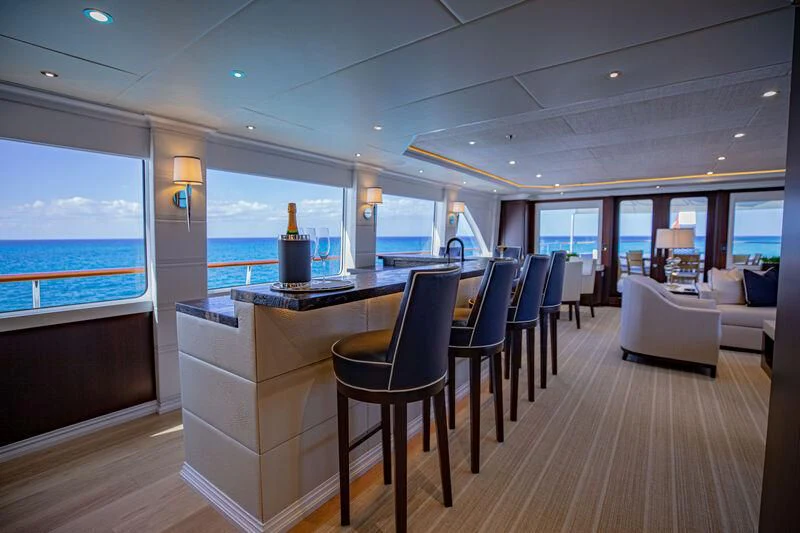 a room with a table and chairs aboard ALTA Yacht for Sale