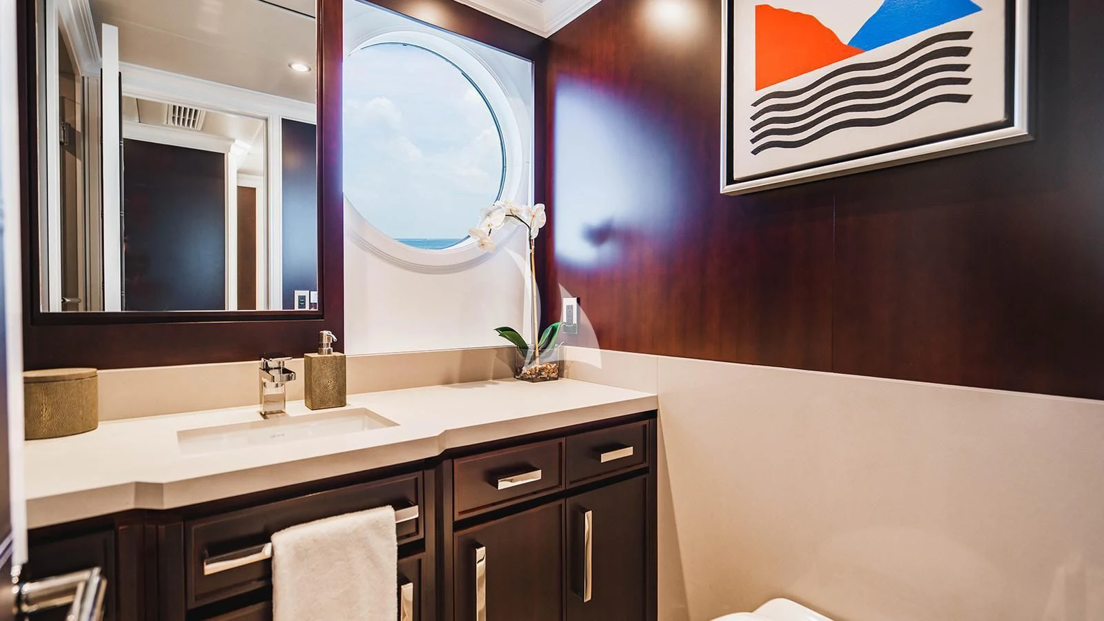 a bathroom with a large mirror aboard ALTA Yacht for Sale